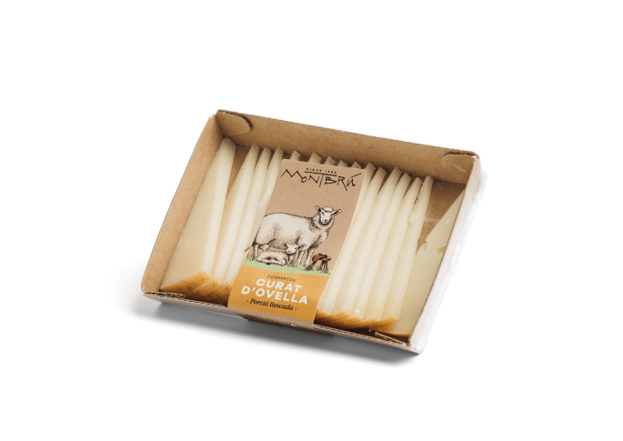 Sliced portion of raw sheep’s milk cured cheese